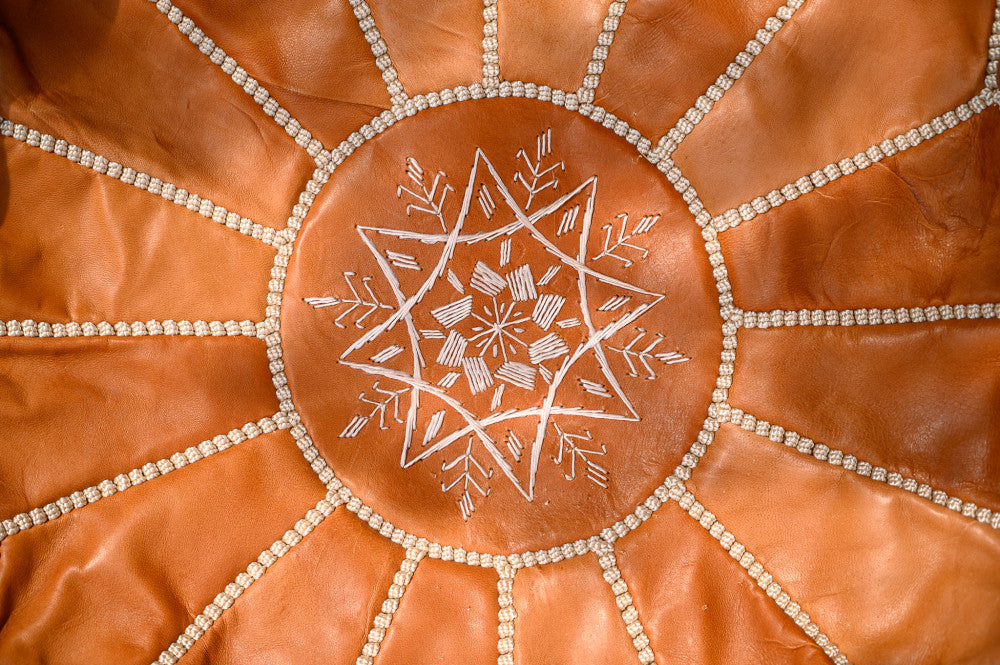 Moroccan leather puff with brown light stitching