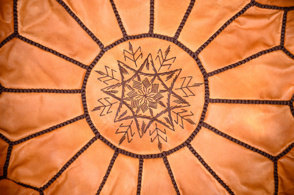 Moroccan leather puff light brown with dark stitching